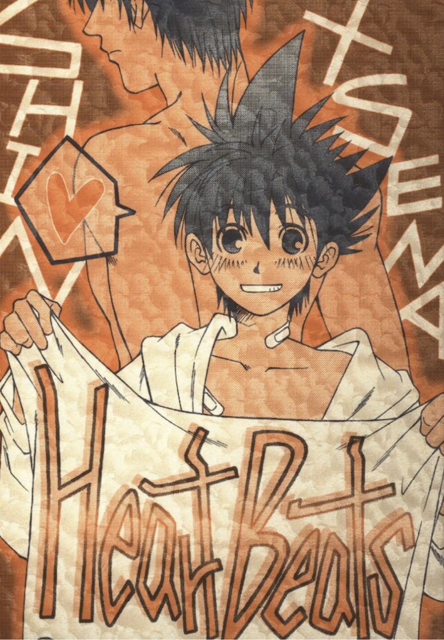 The cover for Heart Beats, which shows Sena holding up a sheet with the title on it. He's blushing and smiling mischievously, wearing only a jacket with bandages covering his neck and shoulder. A nude Shin stands behind Sena, their backs against each other.